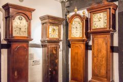 A collection of locally-made longcase clocks