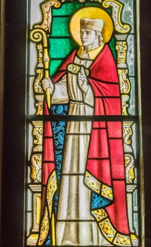 Stained glass window depicting St Chad