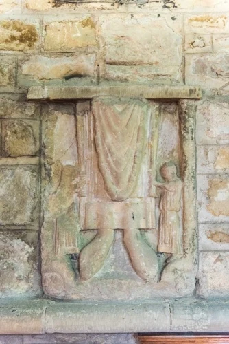 Medieval carving of a robed figure