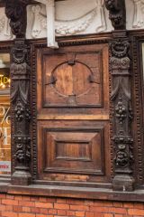 Carved wooden panelling on the front facade