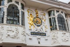 The front facade and royal coat of arms