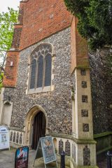 The west door with Tudor brickwork above