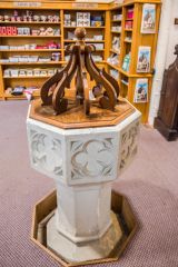 The Victorian font, set into the modern floor