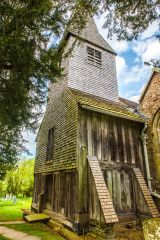 The weatherboarded timber tower of St Nicholas Church