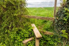 A stile a footpath across the fields