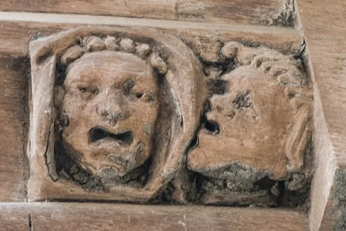 A pair of grotesque faces
