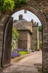 The house through a medieval arch
