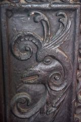 Bench end of a cockerel's head