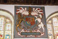 The ornately gilded royal coat of arms