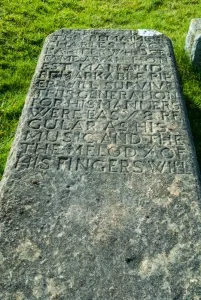 Grave slab of Charles MacArthur, the last hereditary piper of the Macdonalds of Duntulm