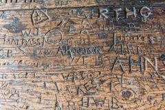 Names carved in the prefect's table