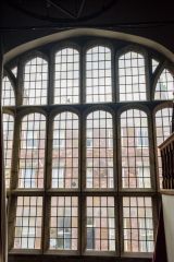 A large mullioned window overlooking King Street