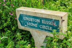 Signpost beside the stone circle's field