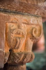 Carved figure of a Green Man on the chancel arch capital
