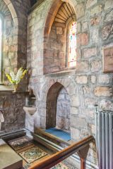 Medieval sedilia and piscina, south chancel wall