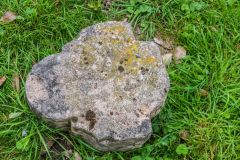 Carved stone from Kirkstead Abbey in the churchyard