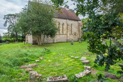 Carved stones from Kirkstead Abbey in the churchyard