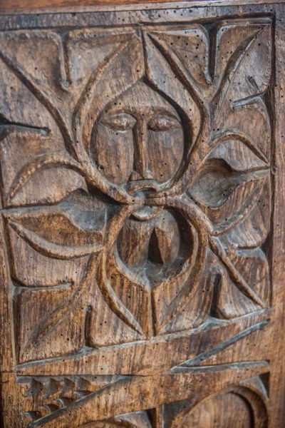 Green Man medieval bench end carving
