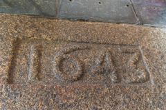 1643 stone slab near the pulpit