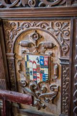 Heraldic arms on old pew ends