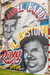 Laurel and Hardy wall art on the museum facade
