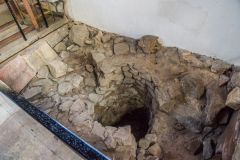 The early medieval well by the chancel arch