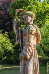 Sculpture of a monk at the entrance to Abbey Wood