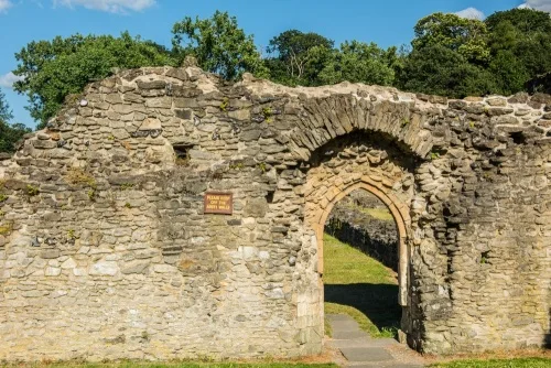 A wall and Gothic arch