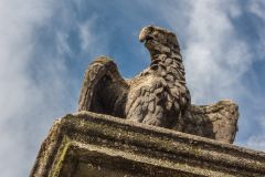 A stone eagle on the gatepost