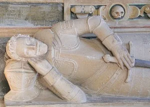 The 17th century Dixon memorial beside the altar