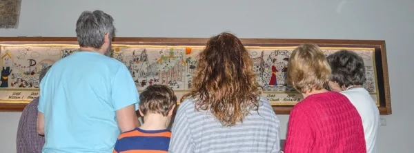 Visitors enjoying the Talking Tapestry