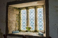 Deeply splayed nave window