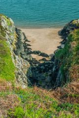 A steep gulley down to the beach