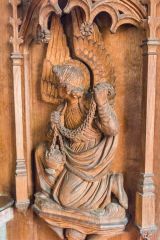 A beautifully carved 19th-century bench end