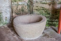 The second medieval font bowl, beside the south door