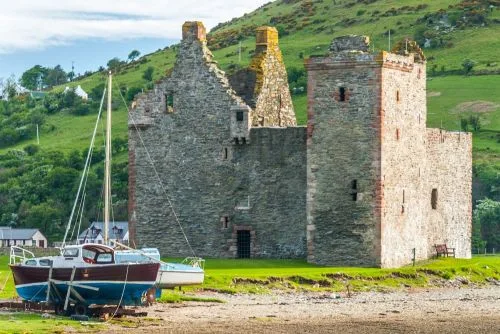 Boats drawn up outside the castle