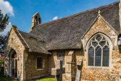 The south elevation and thatched roof