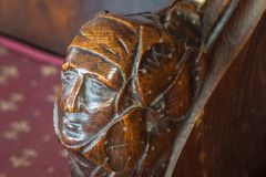 Carved head bench end