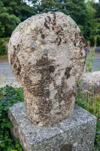 Worn Celtic cross in the churchyard