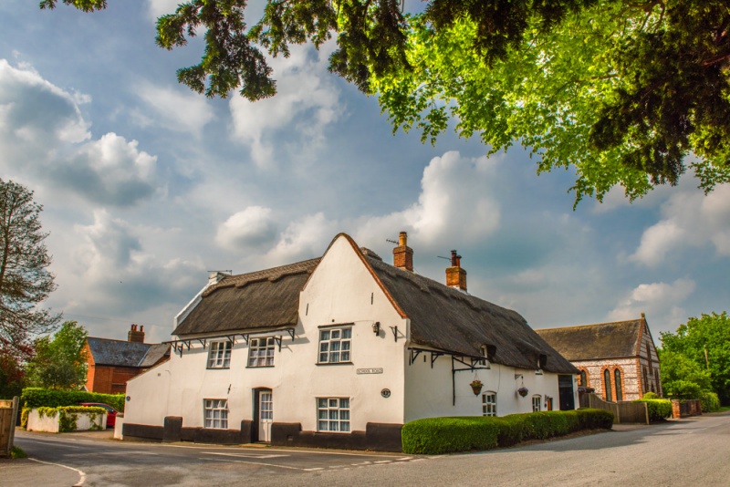 A thatched cottage on School Road in Ludham