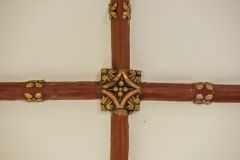 Painted roof boss in the chancel