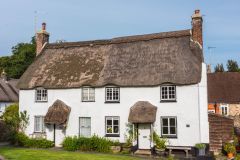 A thatched cottage on the village green