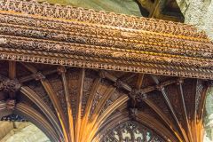The beautifully carved chancel screen canopy