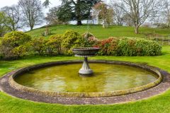 A formal fountain (Norman castle beyond)