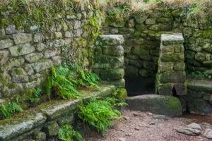 The baptistry and stone bench