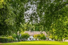 Thatched cottages ring the village green