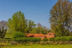 Historic farm building on the circular estate walk