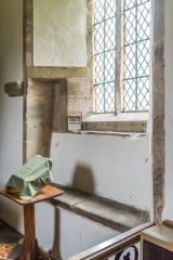 The medieval sedilia (clergy seat) in the sanctuary