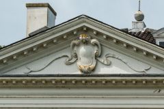 Decorative shield and scrollwork, north front