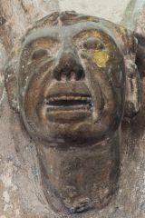 A peculiar corbel head carving